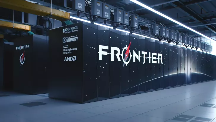 Frontier supercomputer at Oak Ridge features logos for U.S. Department of Energy, Hewlett Packard Enterprise, and AMD in a data center.