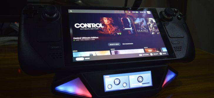 Steam Deck displaying Control Ultimate Edition on charging dock.
