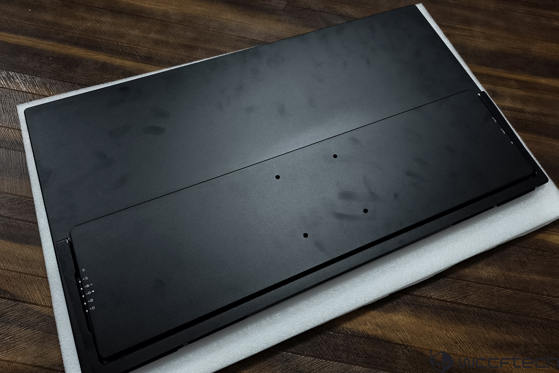 Unbranded metal plate with mounting holes on foam padding.