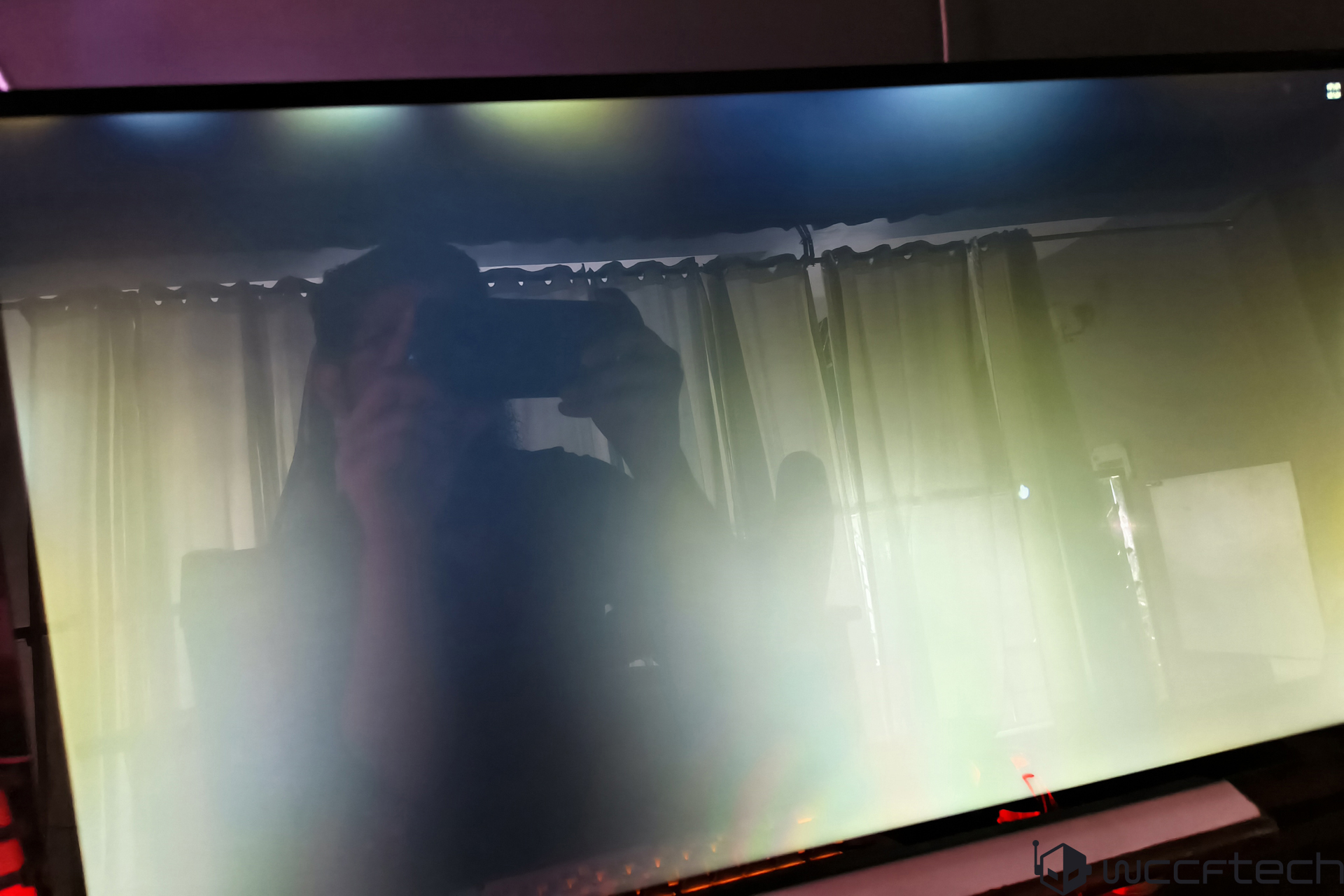Wccftech logo visible on a TV screen with reflection.