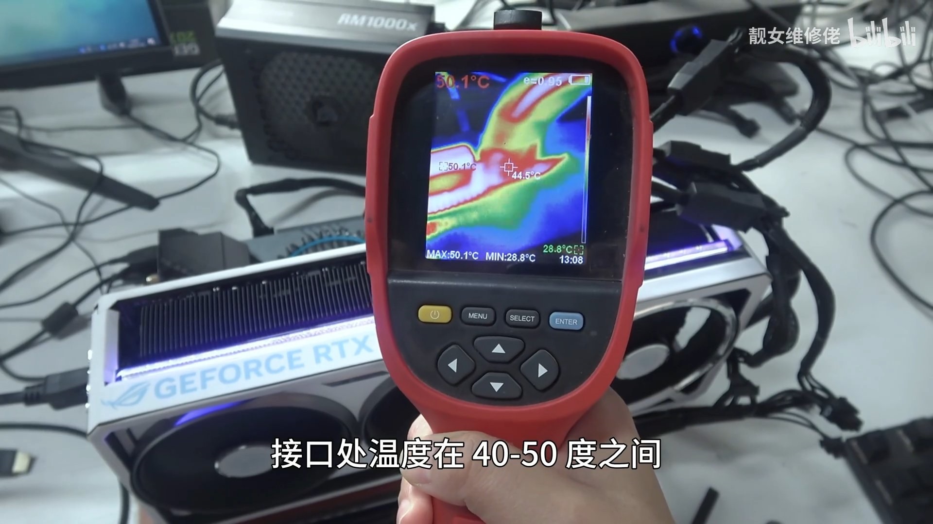 A thermal imaging device displays a temperature readout of 50.1°C-28.8°C in front of an NVIDIA GeForce RTX graphics card.