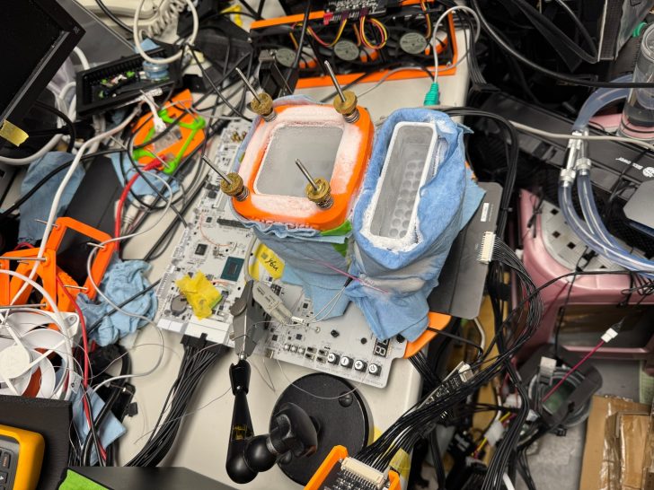 Setup with NVIDIA GeForce GTX 1080Ti and orange liquid nitrogen containers on a cluttered lab bench.