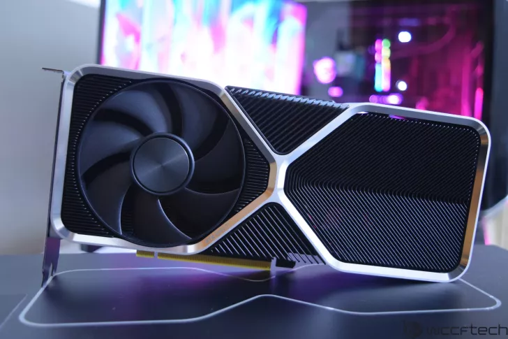 NVIDIA GeForce RTX 4090 Ti graphics card displayed on a computer surface with a colorful background.