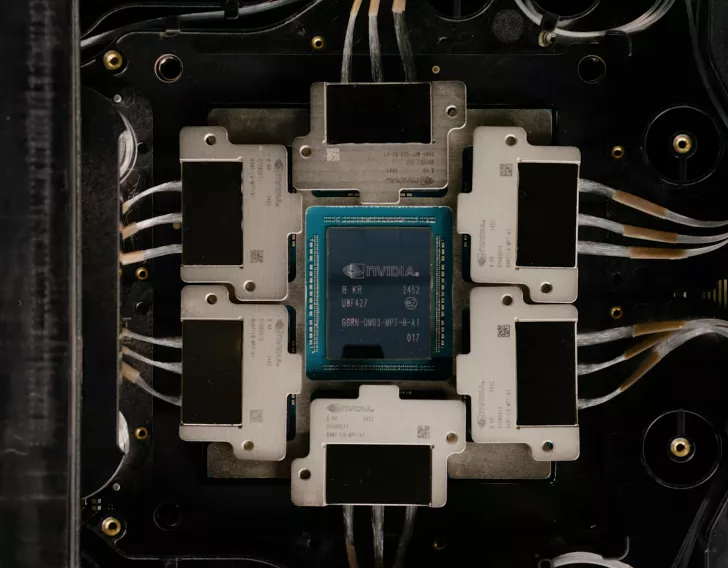 A NVIDIA processor labeled 'B KR UBF427' is centrally placed on a circuit board surrounded by multiple connected heat sinks.