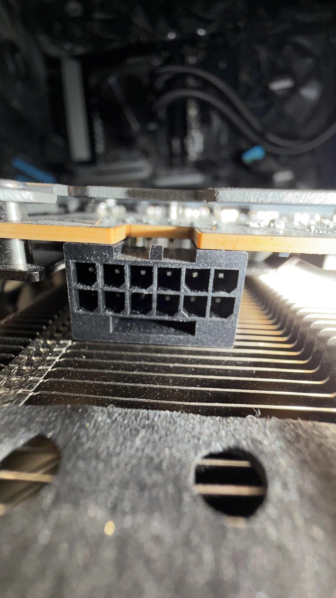 Unbranded 12-pin power connector inside a computer case.