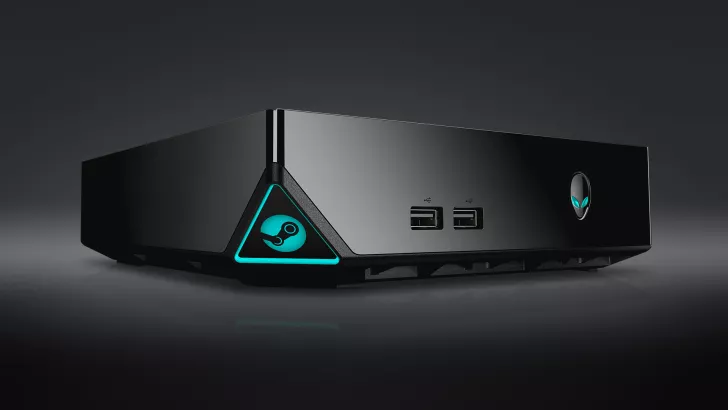 A black Alienware Steam Machine with the Steam logo illuminated in blue, featuring two front USB ports.
