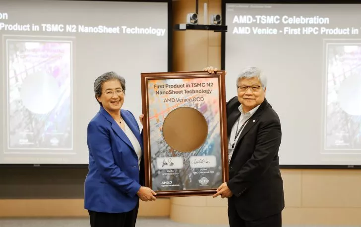 AMD CEO and another person hold a plaque reading 'First Product in TSMC N2 NanoSheet Technology, AMD Venice CCD' during an AMD-TSMC event.
