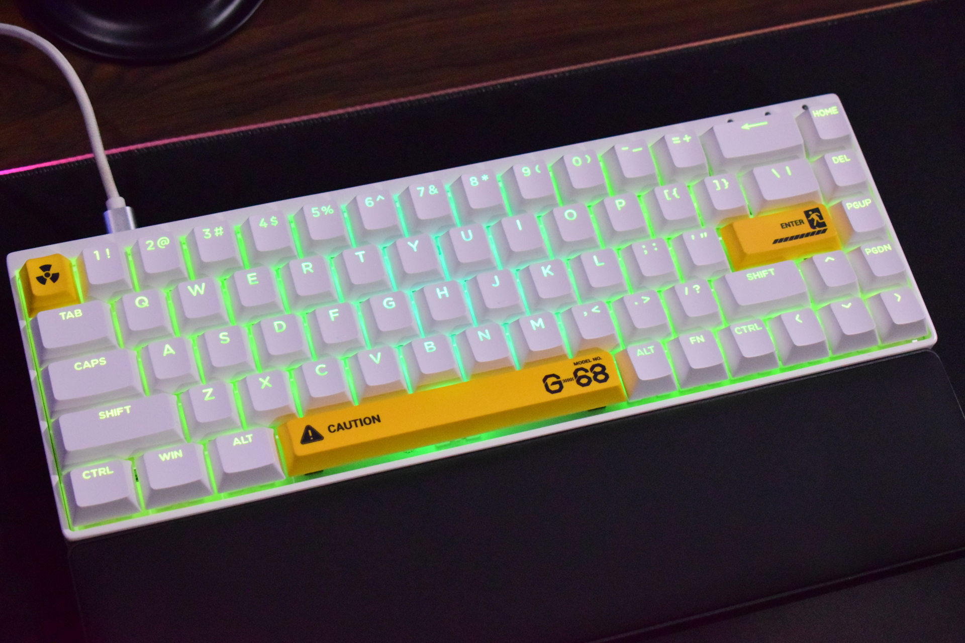 A white G-68 mechanical keyboard with green backlighting features yellow 'CAUTION' and radiation symbol keycaps.