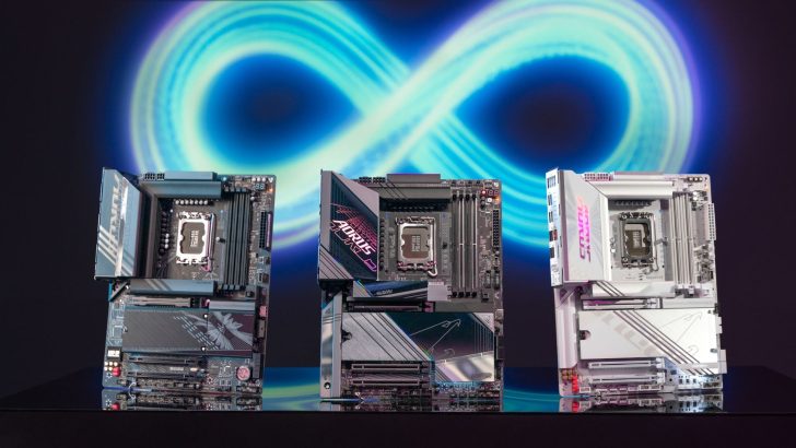 Three Gigabyte motherboards, including the Z790 Aorus Master and Z790 Aorus Elite, are displayed in front of a glowing infinity symbol backdrop.