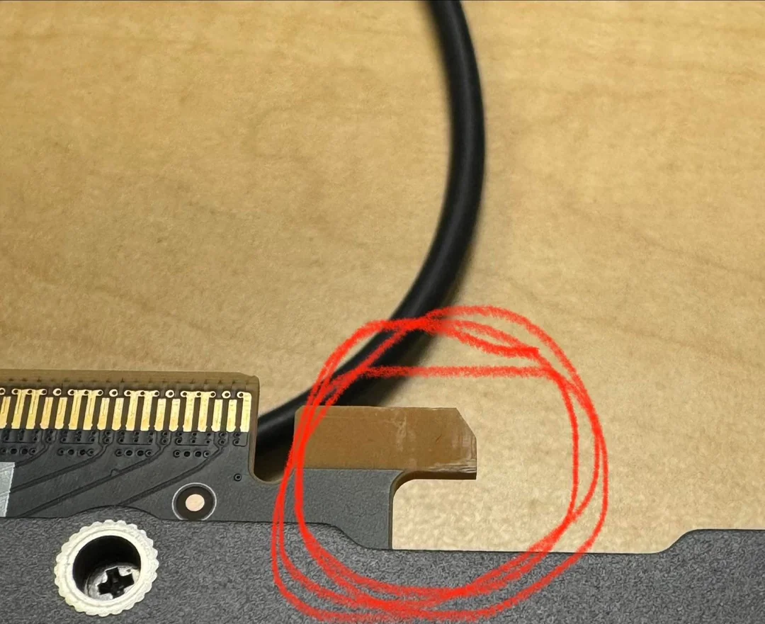 A close-up of a damaged or altered PCIe connector with a red circle highlighting the issue.