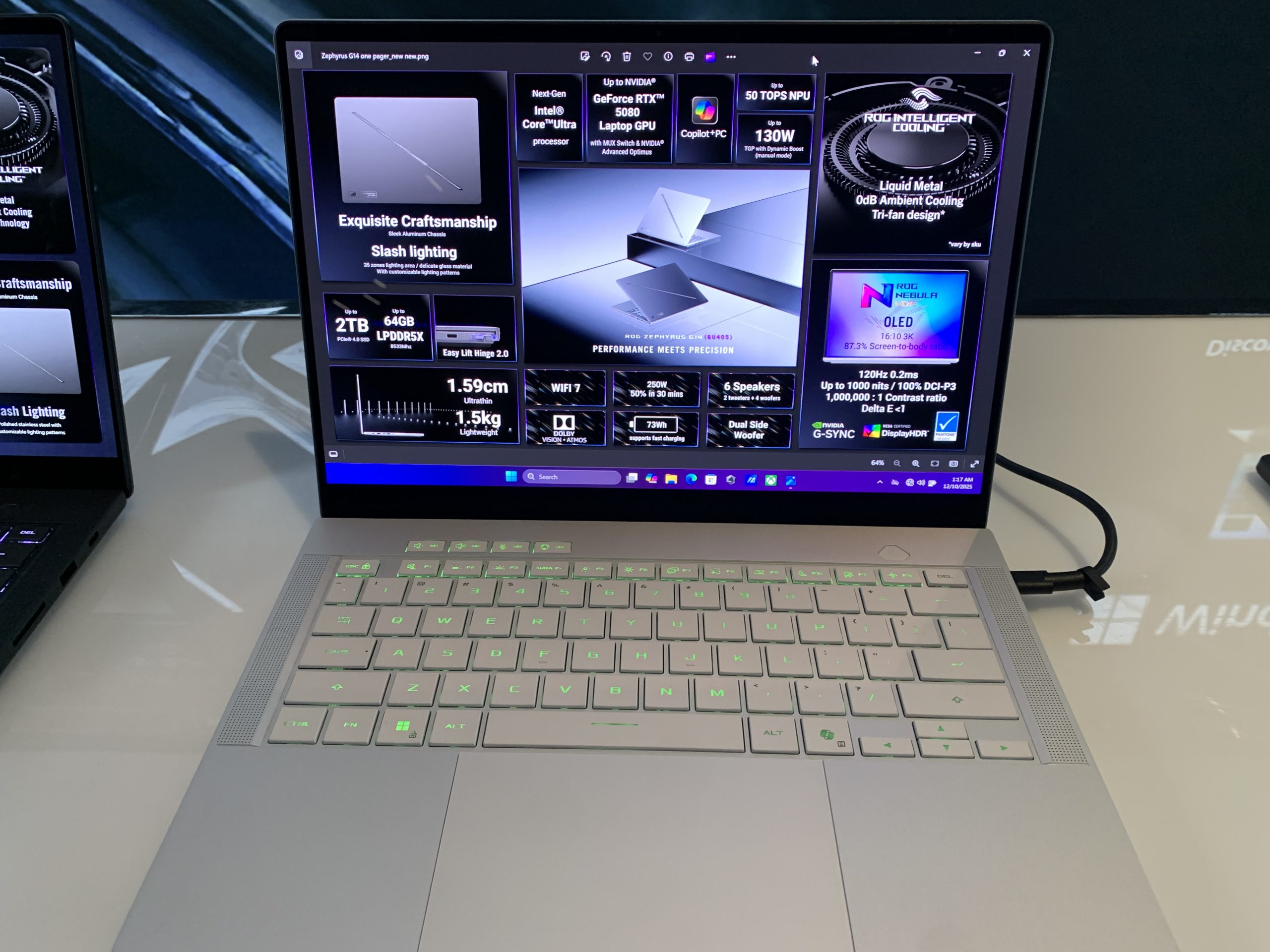 An ASUS ROG Zephyrus G14 laptop displays specs including 'GeForce RTX 5090' GPU, 'AMD Ryzen 9' processor, and '2TB' storage on its screen.