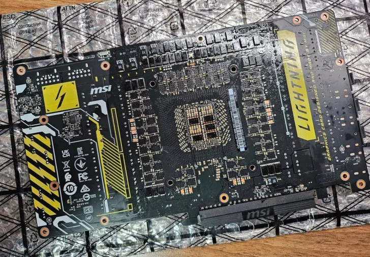 The back of an MSI Lightning graphics card PCB is displayed on anti-static packaging, featuring a prominent 'Lightning' label and multiple visible chip placements.